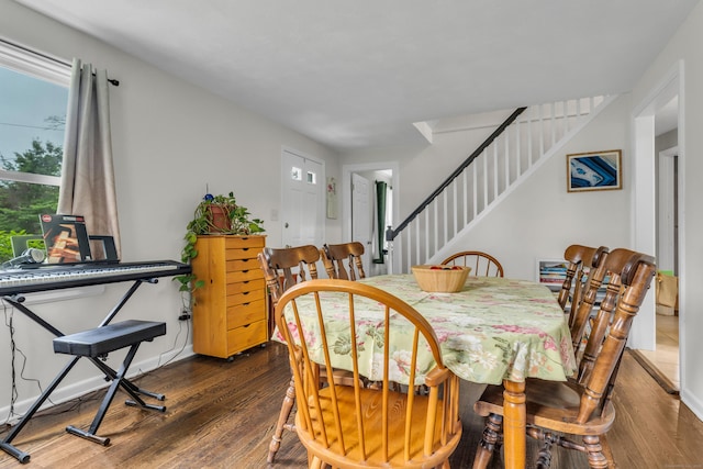 21 Pond Rd, Hamden, CT 06514 - dining area with dark wood-type flooring and stairs