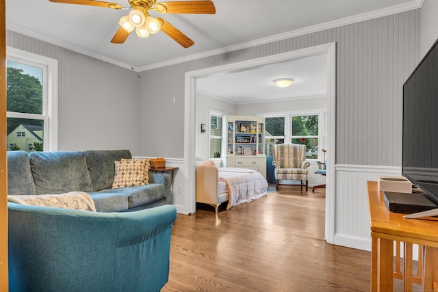 21 Pond Rd, Hamden, CT 06514 - living area with wood finished floors, ceiling fan, crown molding, wainscoting, and a decorative wall