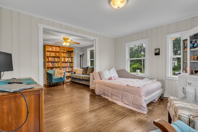 21 Pond Rd, Hamden, CT 06514 - bedroom featuring crown molding, wood finished floors, and a decorative wall
