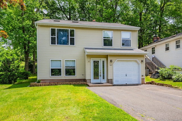 122 Carr Ave, Newington, CT 06111 - traditional home featuring a front lawn, asphalt driveway, and an attached garage