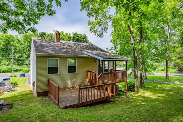 122 Carr Ave, Newington, CT 06111 - back of house featuring a chimney, a wooden deck, a lawn, and roof with shingles