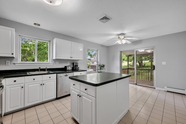 122 Carr Ave, Newington, CT 06111 - kitchen featuring dishwasher, a sink, dark countertops, a ceiling fan, and white cabinets
