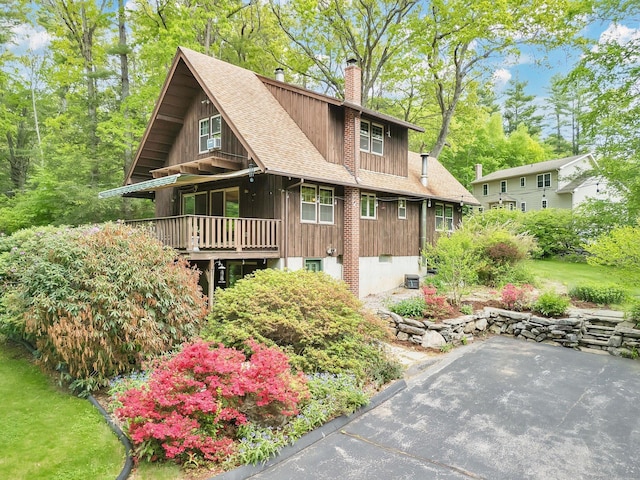 55 Indian Spring Rd, Woodstock, CT 06281 - view of property exterior with a chimney and a shingled roof
