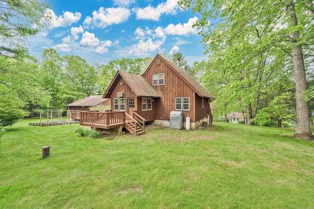 55 Indian Spring Rd, Woodstock, CT 06281 - rear view of property with a wooden deck, a yard, and a shingled roof