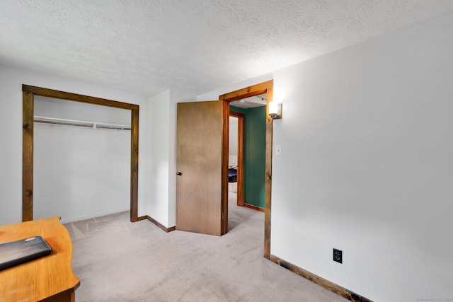 55 Indian Spring Rd, Woodstock, CT 06281 - unfurnished bedroom with carpet floors, baseboards, a textured ceiling, and a closet
