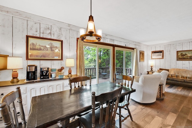 55 Indian Spring Rd, Woodstock, CT 06281 - dining space featuring wood finished floors, wood walls, and a wall mounted AC