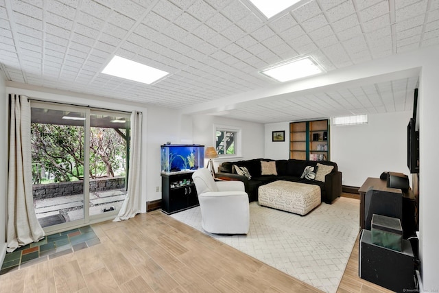 55 Indian Spring Rd, Woodstock, CT 06281 - living room with plenty of natural light, wood finished floors, and baseboards