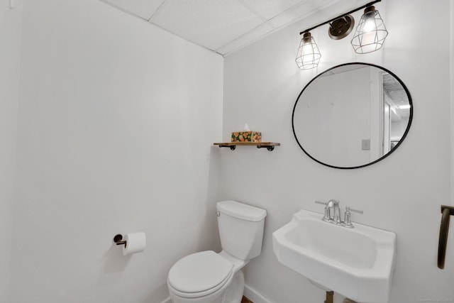 55 Indian Spring Rd, Woodstock, CT 06281 - half bath featuring toilet, a sink, baseboards, and a drop ceiling