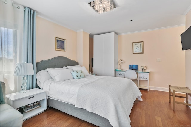 1633 Washington Blvd Unit 3A, Stamford, CT 06902 - bedroom featuring wood finished floors, ornamental molding, and baseboards