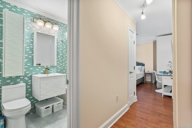 1633 Washington Blvd Unit 3A, Stamford, CT 06902 - corridor with crown molding, tile walls, wood finished floors, and rail lighting