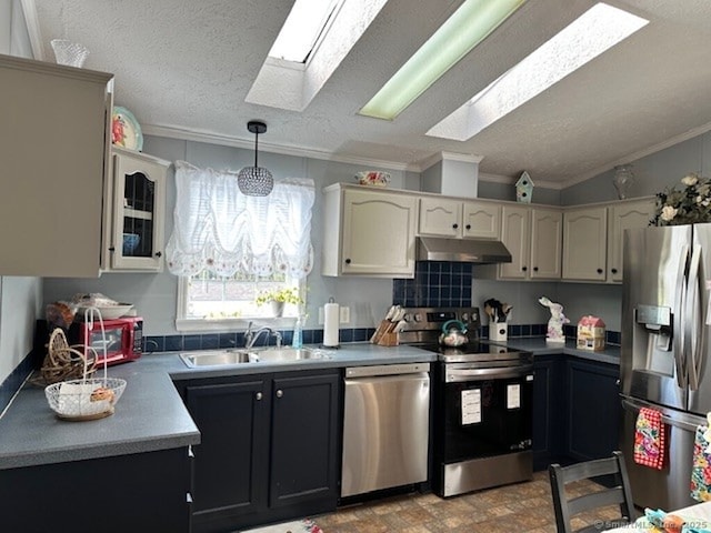 23 N Rd, Southington, CT 06489 - kitchen featuring stainless steel appliances, a sink, a skylight, under cabinet range hood, and ornamental molding