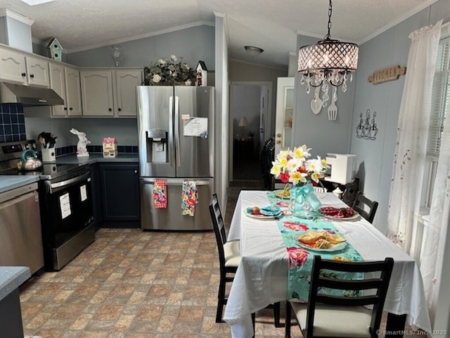 23 N Rd, Southington, CT 06489 - kitchen with stainless steel appliances, under cabinet range hood, crown molding, lofted ceiling, and white cabinets