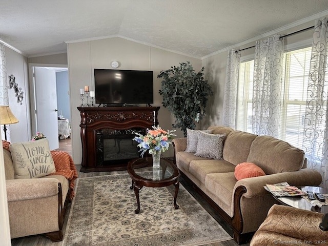 23 N Rd, Southington, CT 06489 - living area with wood finished floors, crown molding, lofted ceiling, and a glass covered fireplace