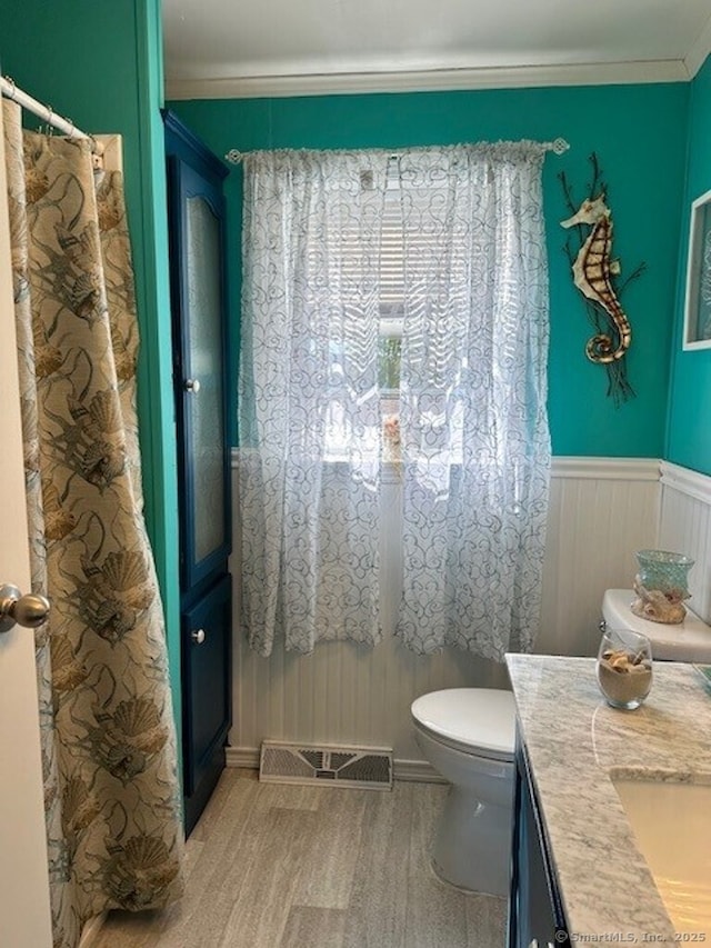 23 N Rd, Southington, CT 06489 - full bathroom featuring wood finished floors, toilet, vanity, and crown molding