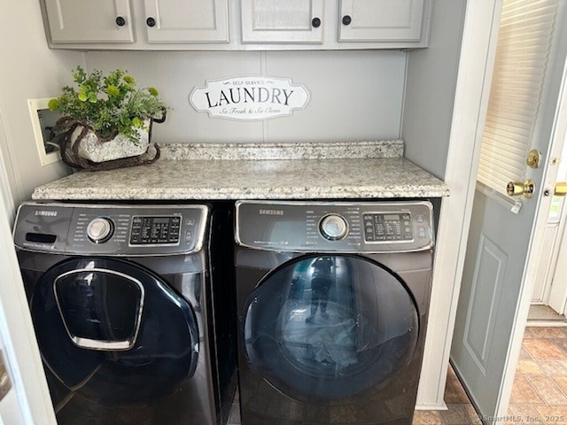 23 N Rd, Southington, CT 06489 - laundry room featuring separate washer and dryer, cabinet space, and stone finish flooring