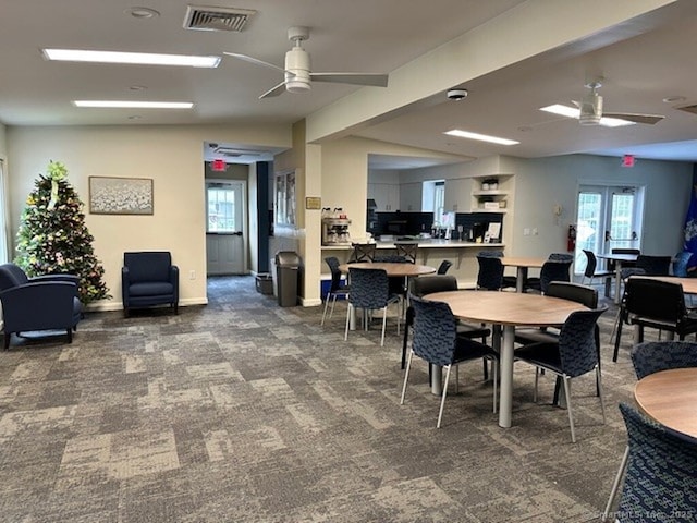23 N Rd, Southington, CT 06489 - dining area featuring a ceiling fan, carpet floors, and healthy amount of natural light