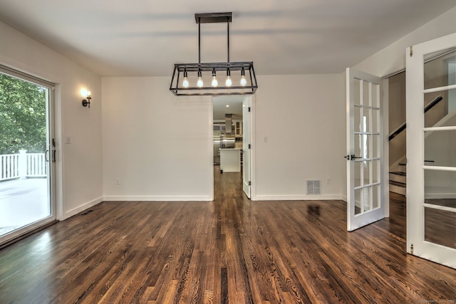66 Penny Ln, Woodbridge, CT 06525 - unfurnished dining area with wood finished floors, stairway, baseboards, and french doors