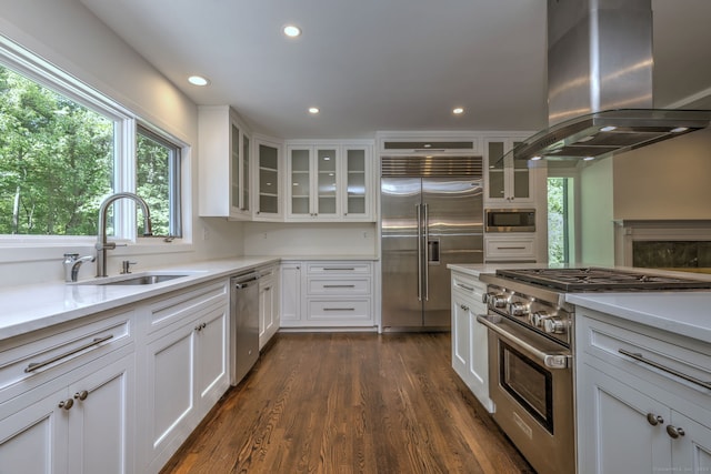 66 Penny Ln, Woodbridge, CT 06525 - kitchen featuring built in appliances, a sink, island range hood, white cabinetry, and recessed lighting