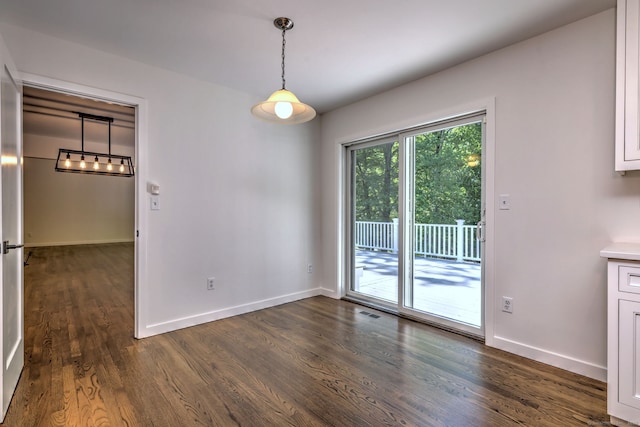 66 Penny Ln, Woodbridge, CT 06525 - unfurnished dining area with dark wood finished floors and baseboards