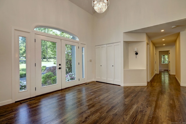 66 Penny Ln, Woodbridge, CT 06525 - foyer with dark wood-style flooring, a high ceiling, a chandelier, french doors, and baseboards