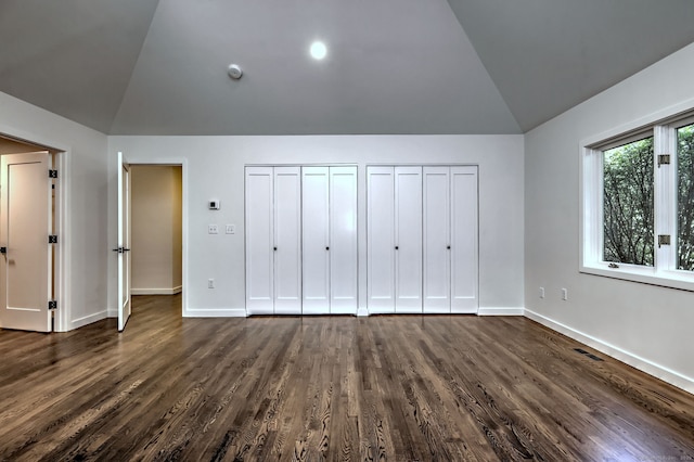 66 Penny Ln, Woodbridge, CT 06525 - unfurnished bedroom featuring vaulted ceiling, multiple closets, dark wood-type flooring, and baseboards
