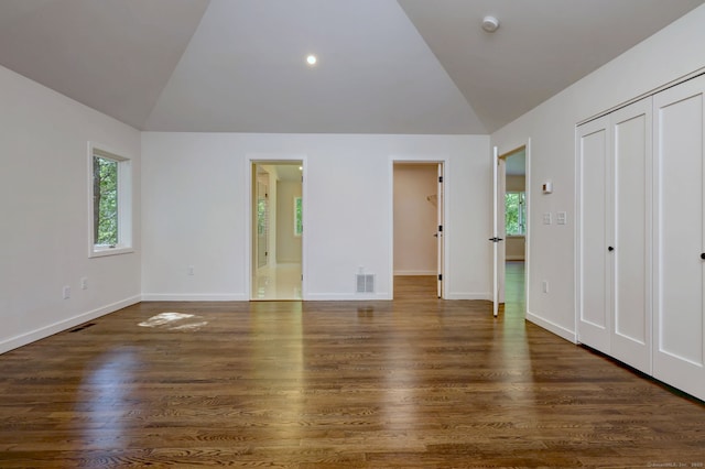 66 Penny Ln, Woodbridge, CT 06525 - unfurnished bedroom with lofted ceiling, connected bathroom, baseboards, and dark wood-type flooring