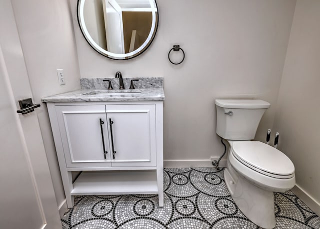 66 Penny Ln, Woodbridge, CT 06525 - bathroom featuring toilet, baseboards, vanity, and tile patterned floors