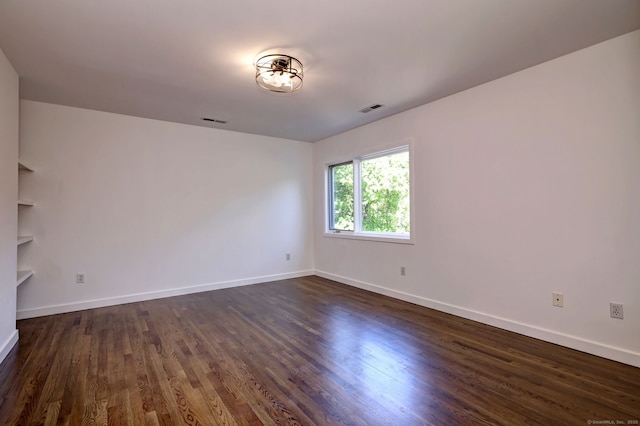 66 Penny Ln, Woodbridge, CT 06525 - spare room featuring baseboards and dark wood-type flooring