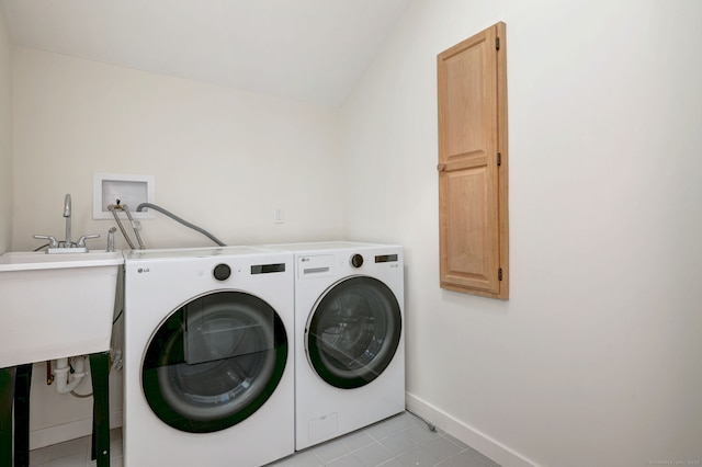66 Penny Ln, Woodbridge, CT 06525 - laundry area with washing machine and clothes dryer, cabinet space, baseboards, and light tile patterned floors