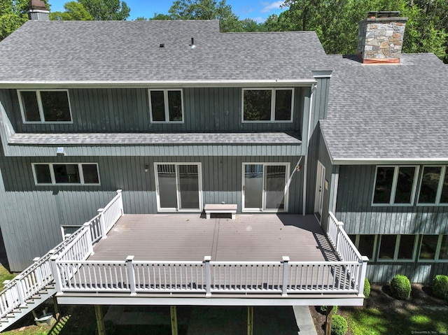 66 Penny Ln, Woodbridge, CT 06525 - back of house featuring a chimney, a shingled roof, and a deck