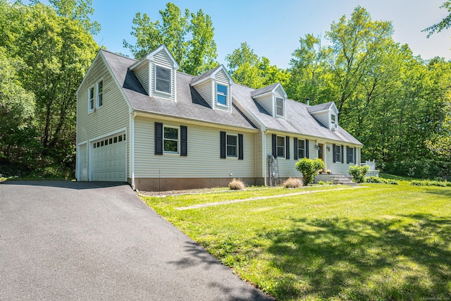 15 Brittany Dr, Durham, CT 06422 - cape cod-style house with asphalt driveway, an attached garage, and a front yard
