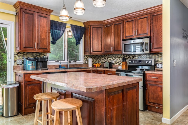 15 Brittany Dr, Durham, CT 06422 - kitchen featuring stainless steel appliances, a sink, plenty of natural light, and a center island