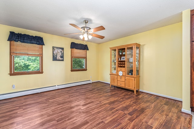 15 Brittany Dr, Durham, CT 06422 - spare room with wood finished floors, a ceiling fan, a baseboard heating unit, and baseboards