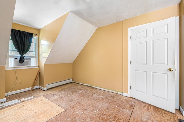 15 Brittany Dr, Durham, CT 06422 - bonus room featuring baseboard heating, cooling unit, vaulted ceiling, and baseboards