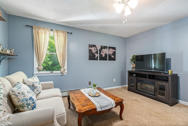 15 Brittany Dr, Durham, CT 06422 - living room featuring a baseboard heating unit, carpet flooring, a textured ceiling, ceiling fan, and baseboards