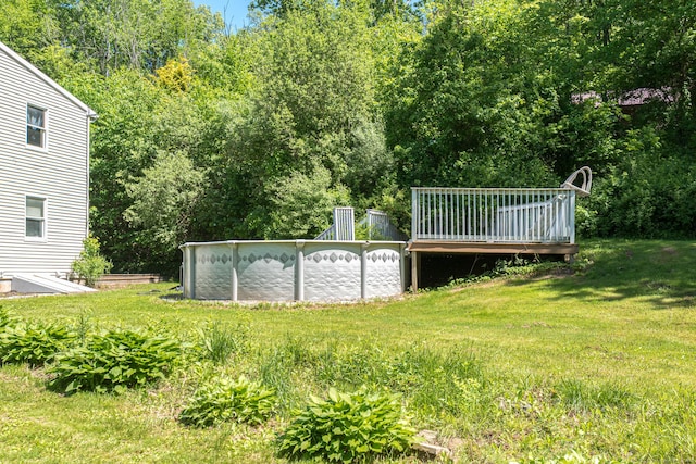 15 Brittany Dr, Durham, CT 06422 - view of green lawn featuring an outdoor pool and a deck