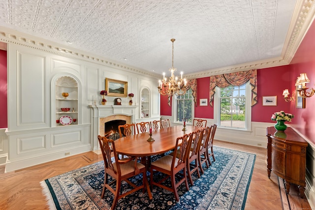 61 High Ridge Ave, Ridgefield, CT 06877 - dining room with a chandelier, a wainscoted wall, ornamental molding, a high end fireplace, and an ornate ceiling