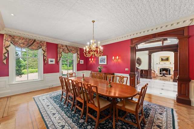 61 High Ridge Ave, Ridgefield, CT 06877 - dining space with decorative columns, wainscoting, a chandelier, and ornamental molding