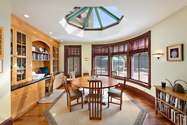 61 High Ridge Ave, Ridgefield, CT 06877 - dining room featuring wood finished floors, a skylight, baseboards, built in shelves, and recessed lighting