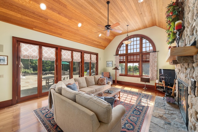 61 High Ridge Ave, Ridgefield, CT 06877 - living room with vaulted ceiling, ceiling fan, wood finished floors, a fireplace, and baseboards