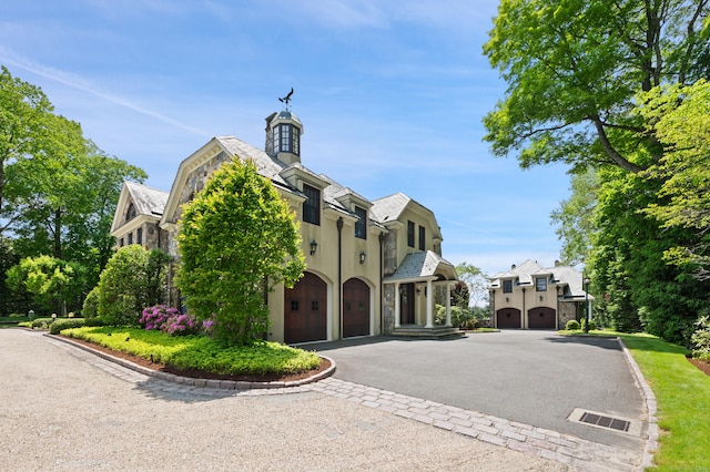 61 High Ridge Ave, Ridgefield, CT 06877 - view of property featuring an attached garage and asphalt driveway