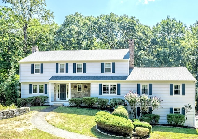 498 Nod Hill Rd, Wilton, CT 06897 - view of front of property with a chimney, a front lawn, and roof with shingles