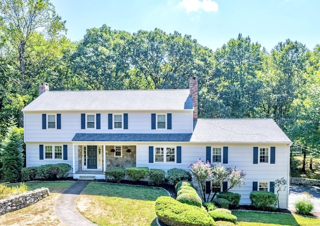 498 Nod Hill Rd, Wilton, CT 06897 - view of front of property featuring a chimney, a front lawn, a porch, and a shingled roof