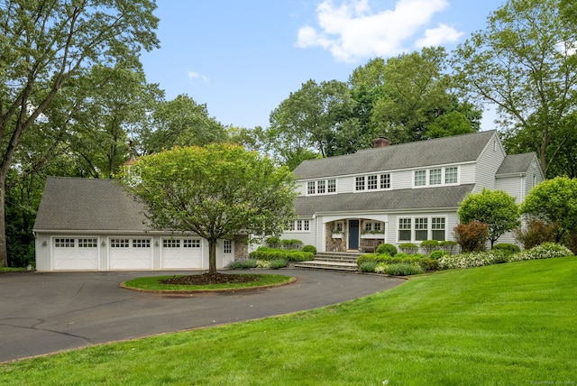 63 Fitch Ln, New Canaan, CT 06840 - view of front of property featuring a front lawn, asphalt driveway, and a chimney