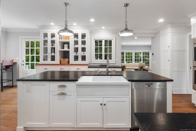 63 Fitch Ln, New Canaan, CT 06840 - kitchen featuring dishwasher, dark countertops, white cabinets, a sink, and crown molding