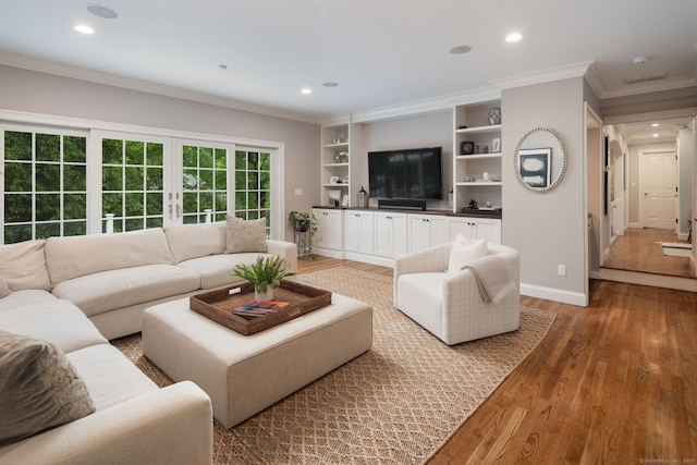63 Fitch Ln, New Canaan, CT 06840 - living room with ornamental molding, recessed lighting, wood finished floors, baseboards, and built in shelves