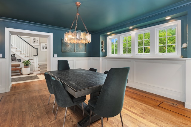 63 Fitch Ln, New Canaan, CT 06840 - dining area with a decorative wall, stairway, crown molding, healthy amount of natural light, and a chandelier