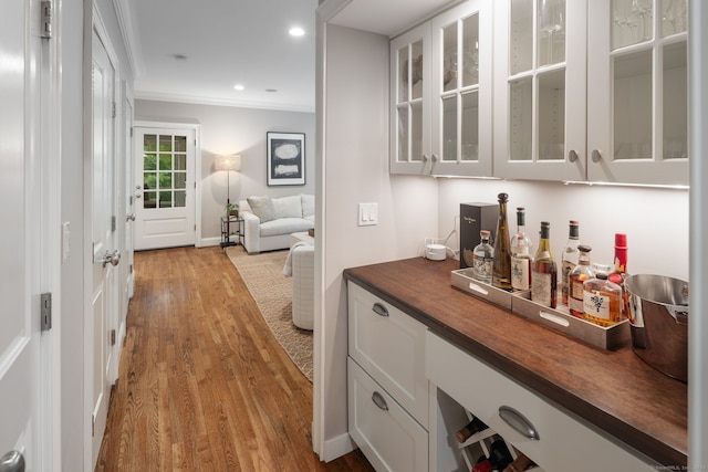 63 Fitch Ln, New Canaan, CT 06840 - indoor dry bar with ornamental molding, wood finished floors, recessed lighting, and baseboards