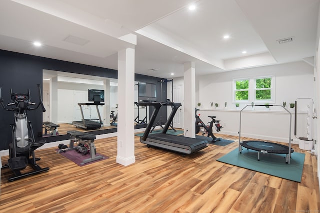 63 Fitch Ln, New Canaan, CT 06840 - workout area with wood finished floors, baseboards, recessed lighting, and a raised ceiling