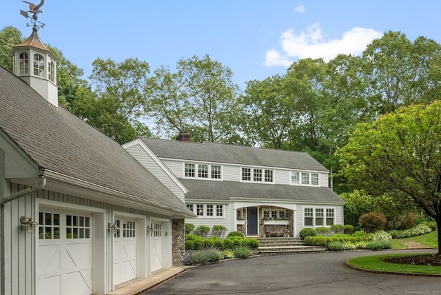 63 Fitch Ln, New Canaan, CT 06840 - shingle-style home with driveway, a garage, a chimney, and roof with shingles
